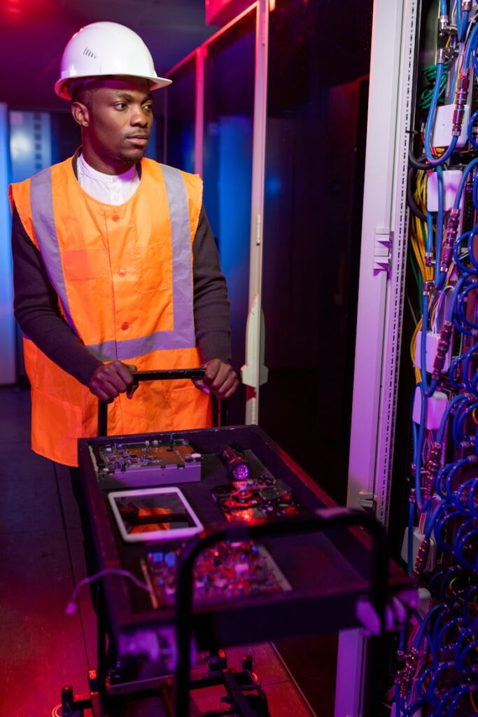 A Trahezy technician servicing rack-mounted equipment on site